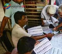 Booth Level Officer visiting households during voter verification drive in Odisha.