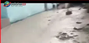 Ash slurry water spreads across roadside areas and agricultural land after an NTPC pipeline burst in Kaniha, Angul district.